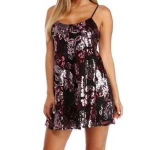black/multicolor spaghetti strap dress with a sequin floral print.